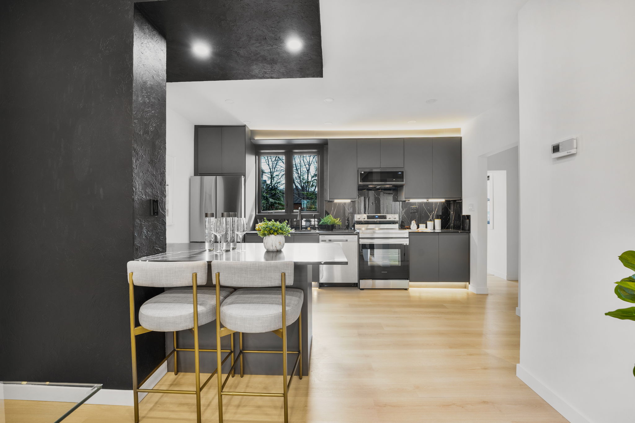 Black and brass kitchen renovation completed by ASM Renovations